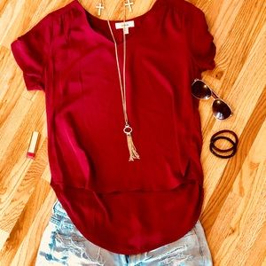 Crimson/ deep red blouse.